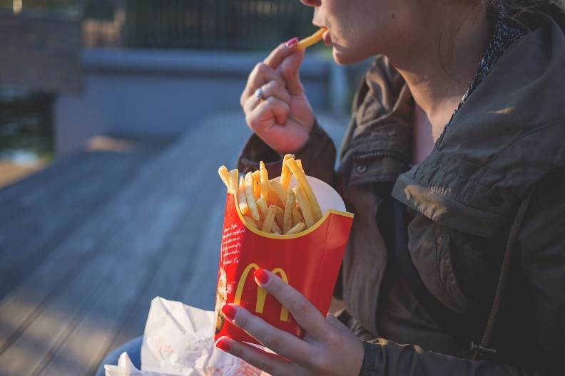 Photo of a person eating fast food