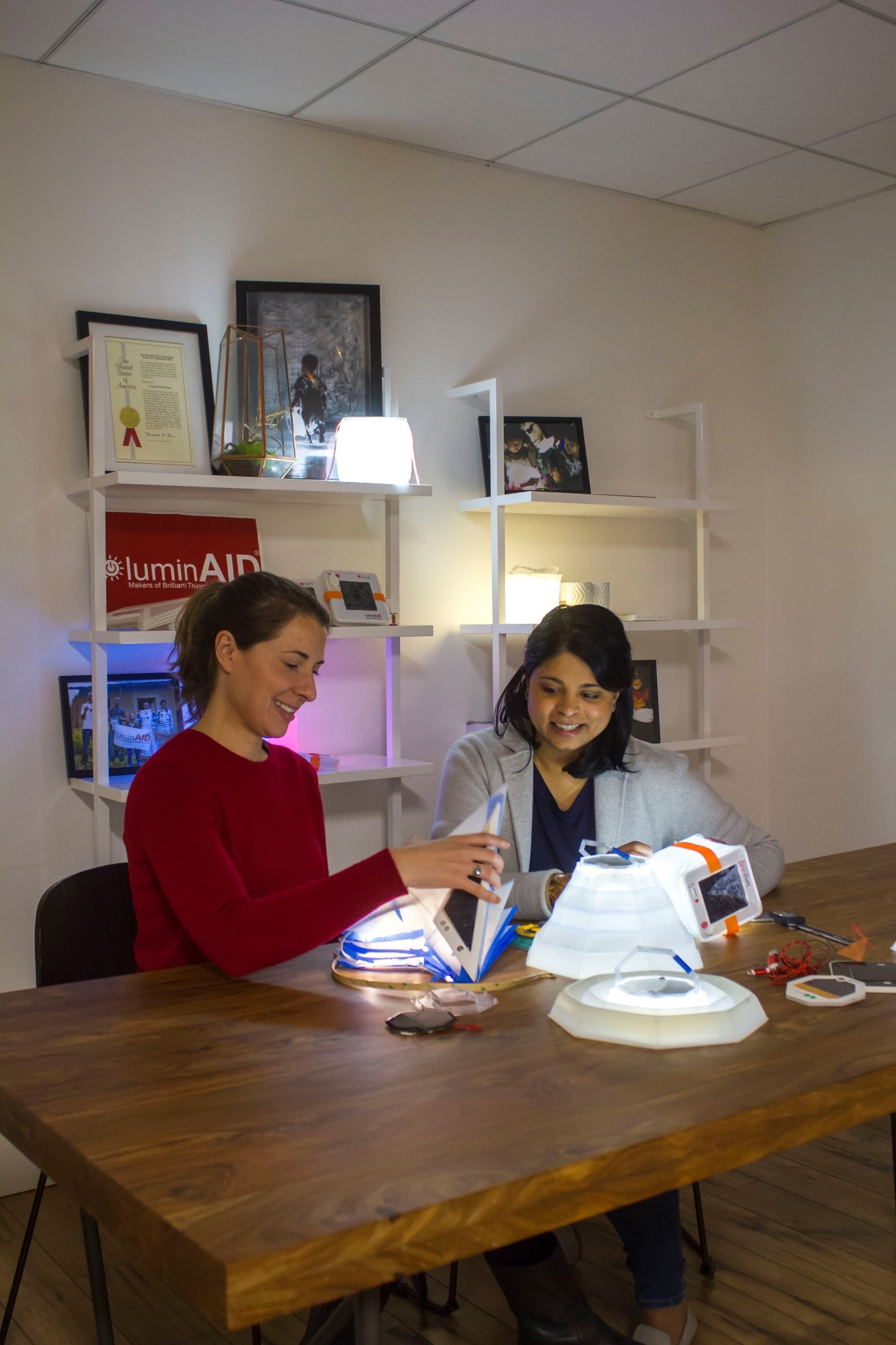 Inventors Anna Stork and Andrea Shreshta with the LuminAID portable lamp