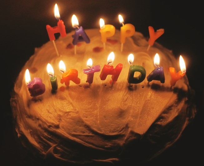Birthday cake with lit candles Birthday cake with lit candles