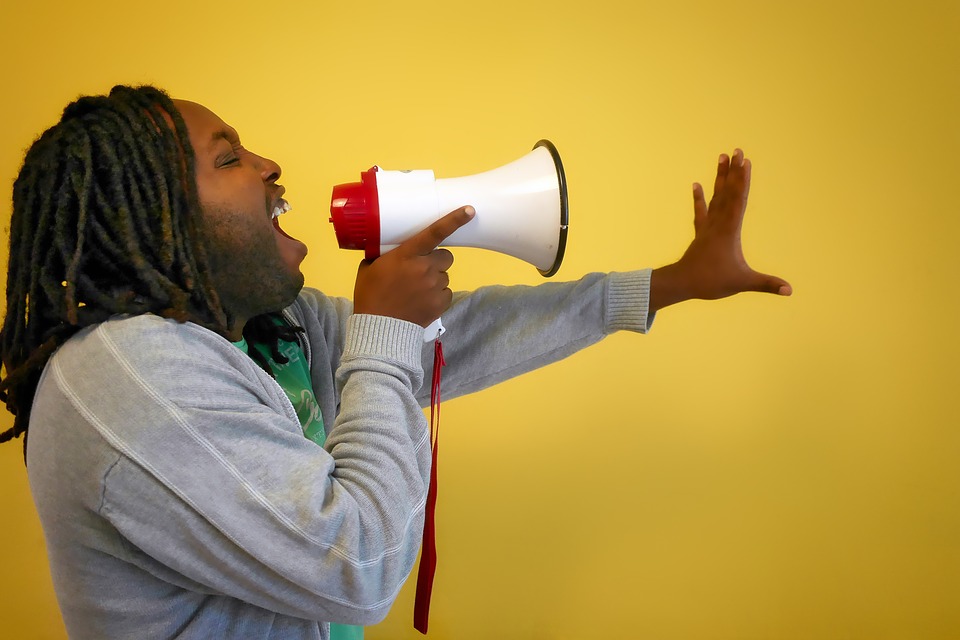 A man using a megaphone. 