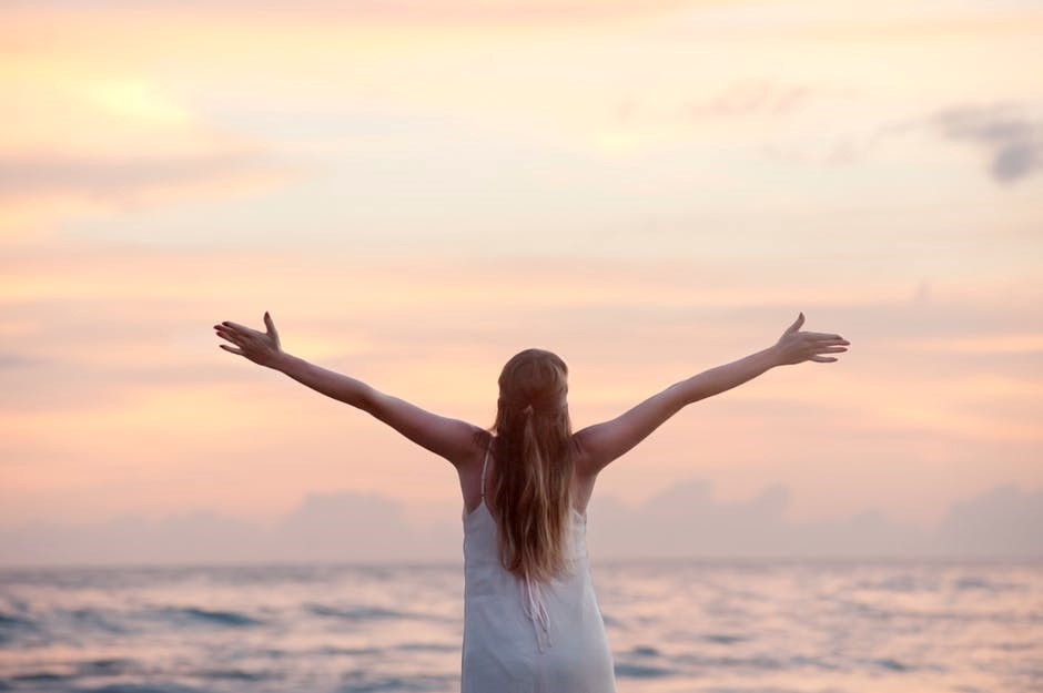 Girls with arms stretched as a sign of freedom